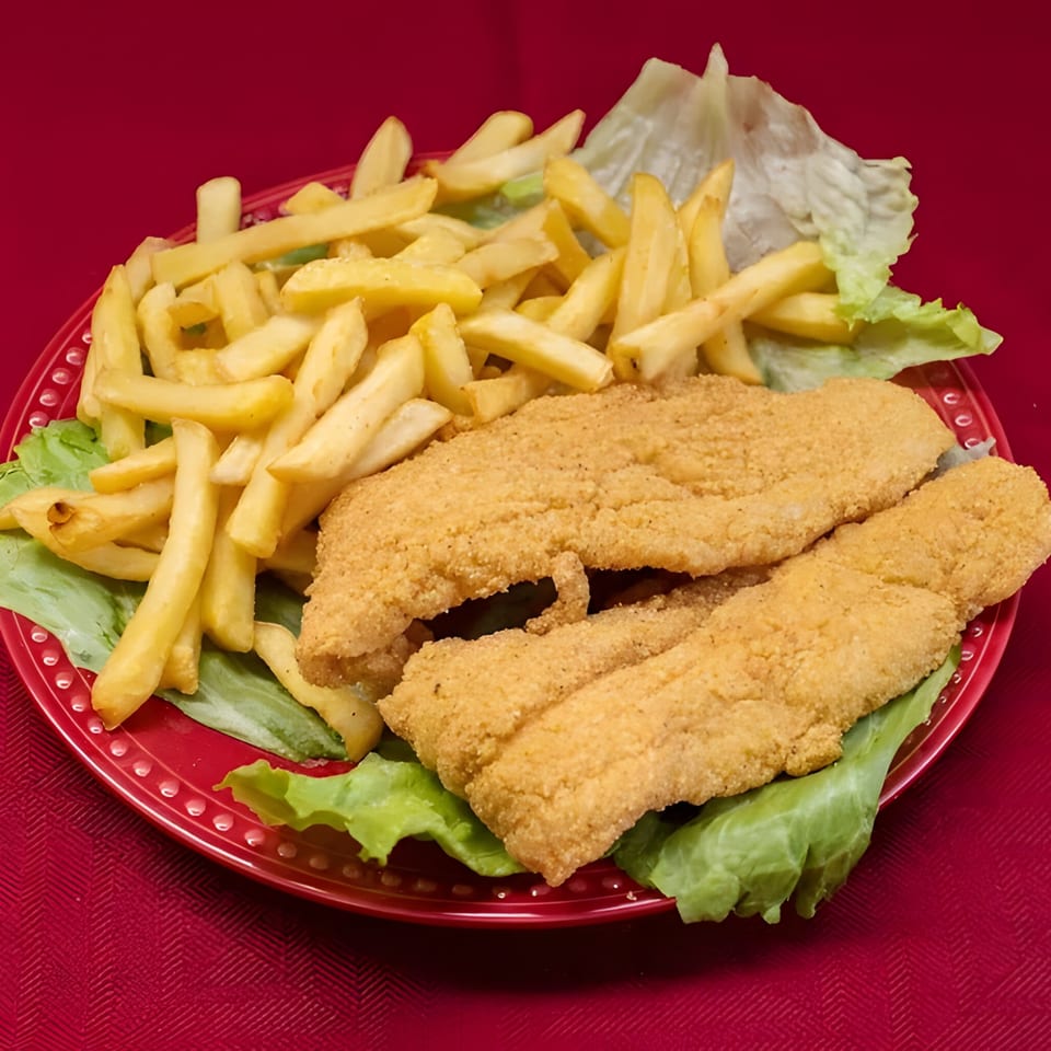 Golden fried fish fillets and french fries on a bed of lettuce, served on a red plate.